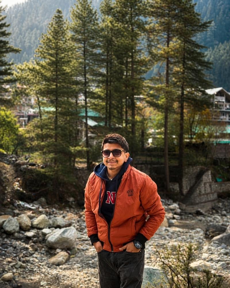 Shivam Attri, AEO consultant and AI-visible web designer, in a Himalayan pine forest